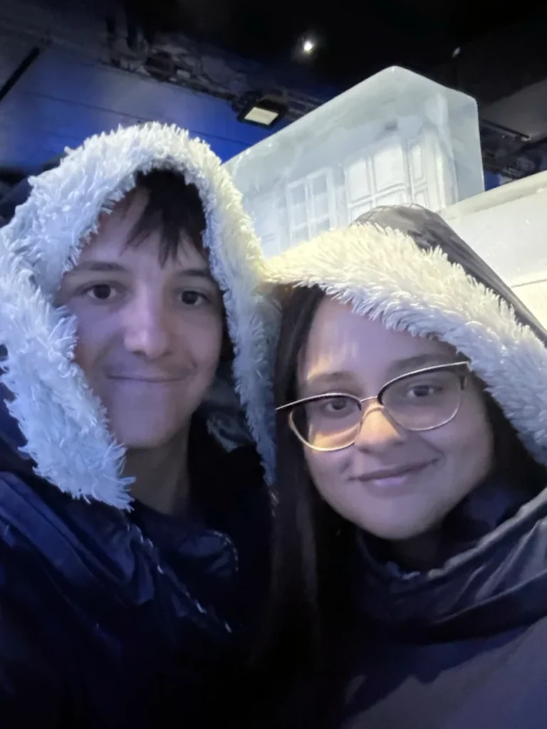Cyprien and Martina wearing thermal capes inside ICEBAR Stockholm