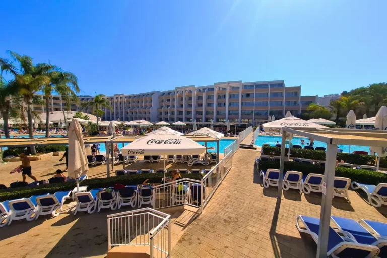 Relaxing poolside at db Hotel Malta, perfect for a sunny day.