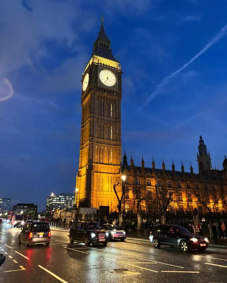 Big Ben illuminated at night, standing tall against the dark sky, showcasing London’s iconic landmark in all its grandeur.