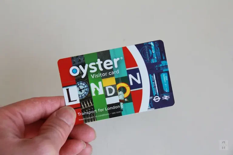 An Hand holding an Oyster Visitor Card
